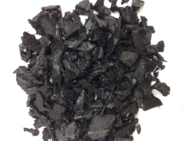 pile of black colored rubber mulch