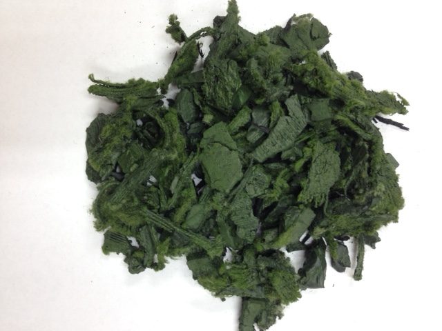 pile of green colored rubber mulch